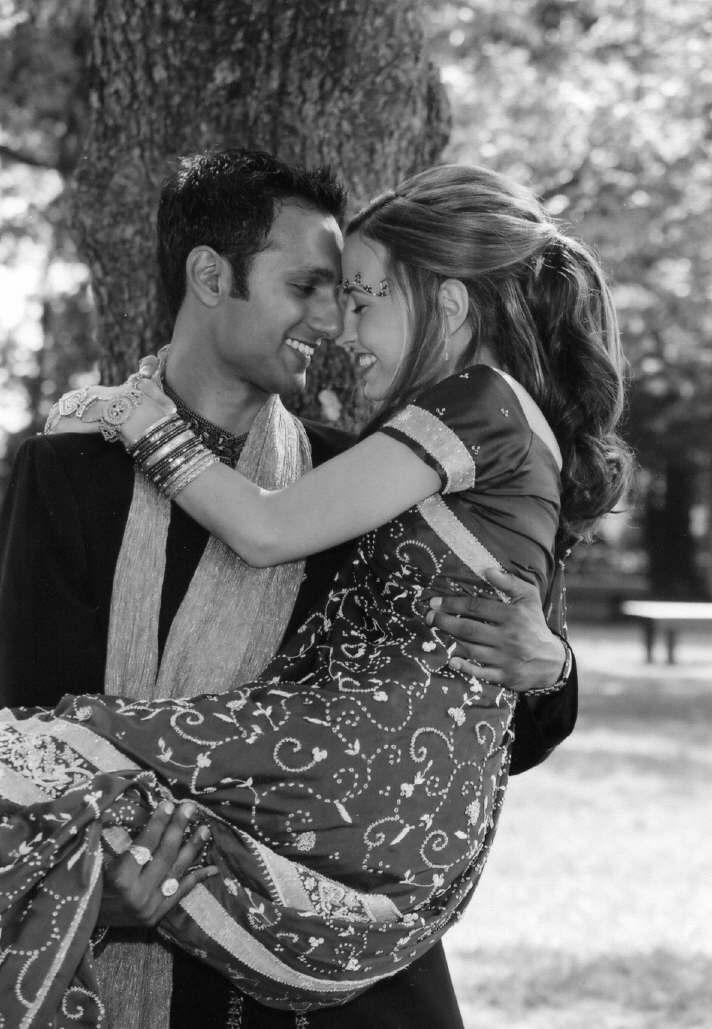 Groom carries the Bride